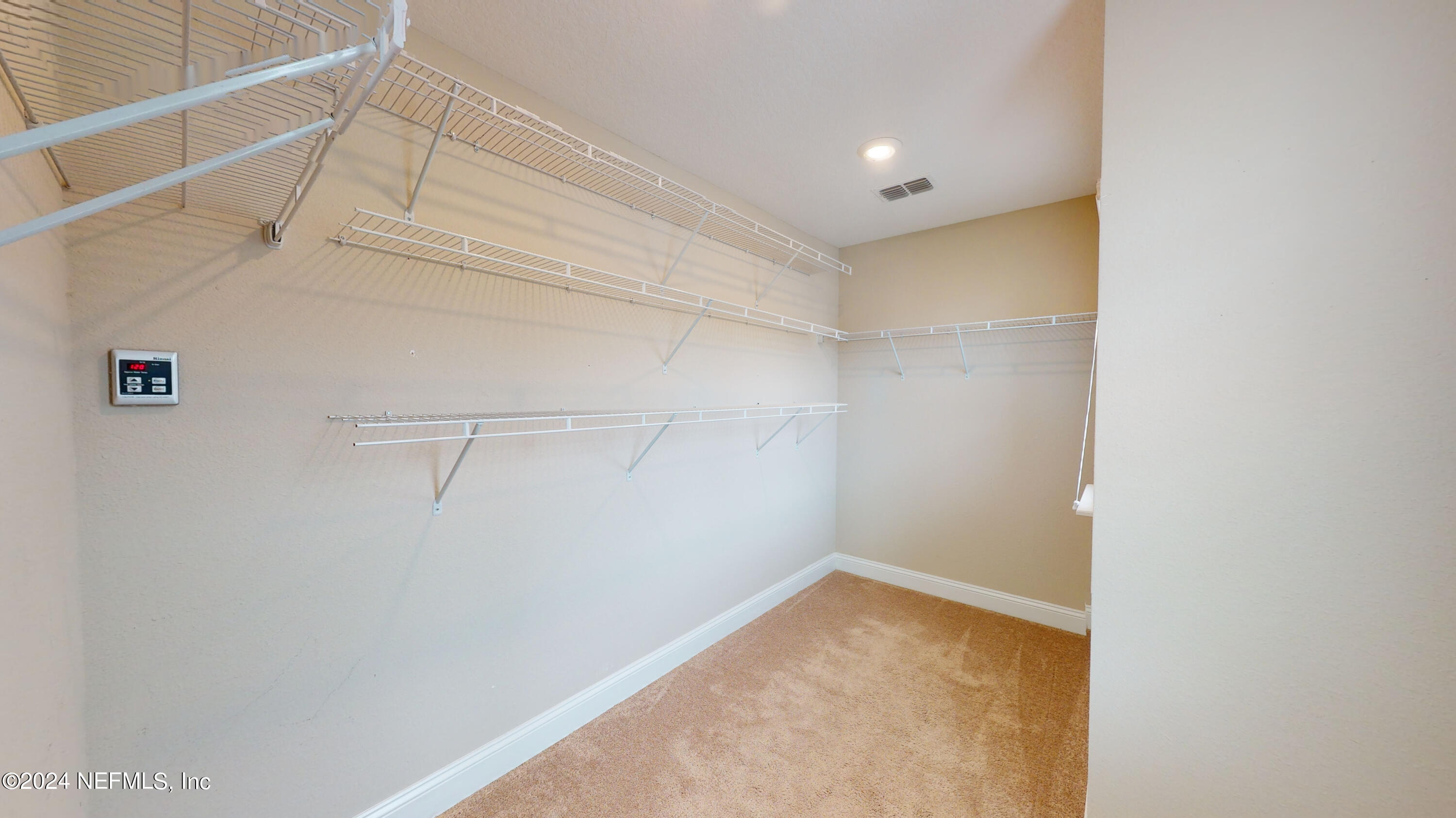 201 Silver Creek Place St. Augustine, FL 32095 - Photo 18 of 25 a view of a room with racks on the wall