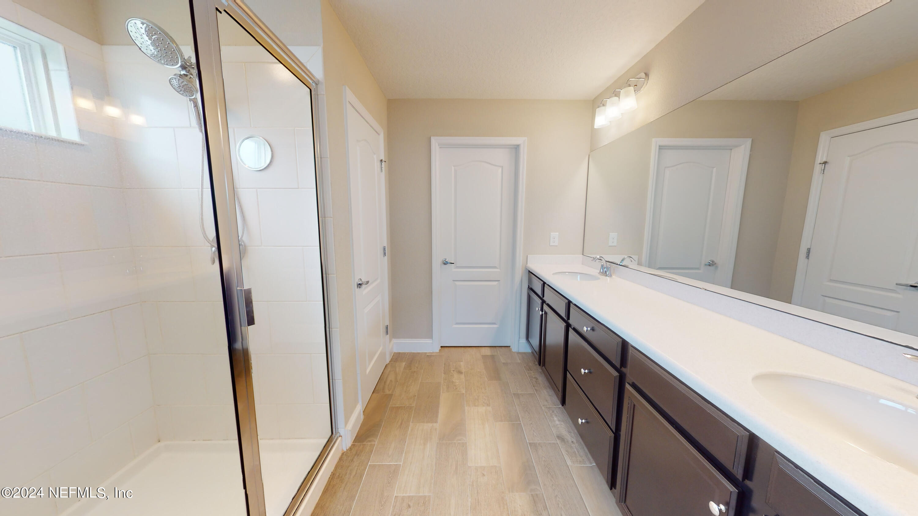 201 Silver Creek Place St. Augustine, FL 32095 - Photo 19 of 25 a bathroom with a double vanity sink and mirror