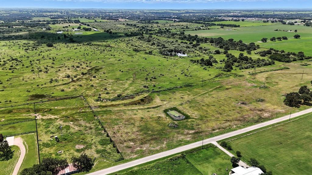 Lot 6 Colony Road Tolar, TX 76476 - Photo 3 of 10 an aerial view of a yard with a table and chairs