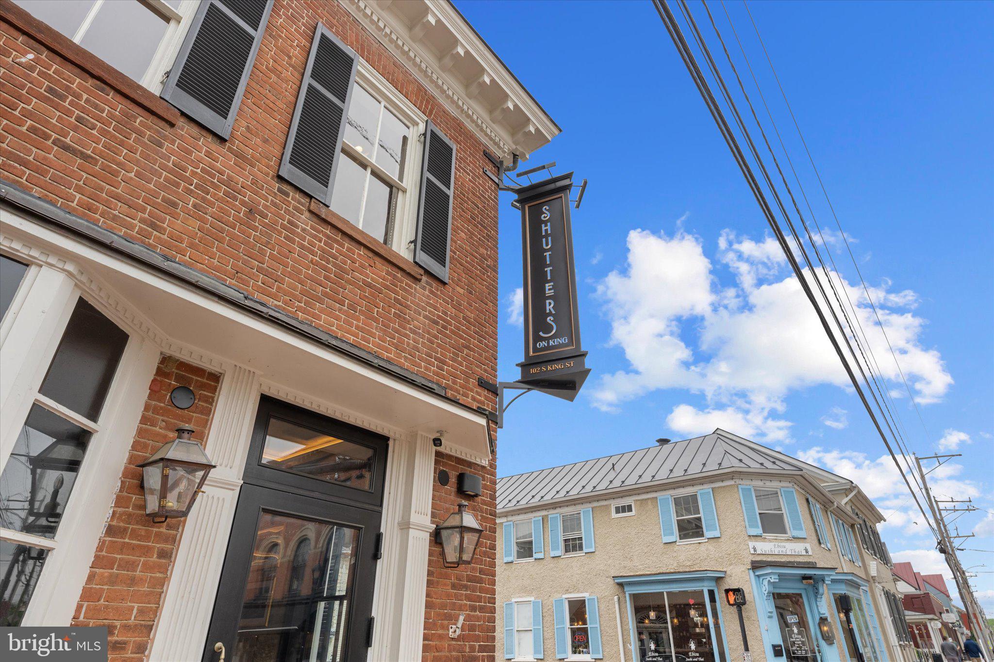 503 Sunset View Terrace Southeast, Unit 101 Leesburg, VA 20175 - Photo 35 of 39 Charming brick facade with inviting sign.