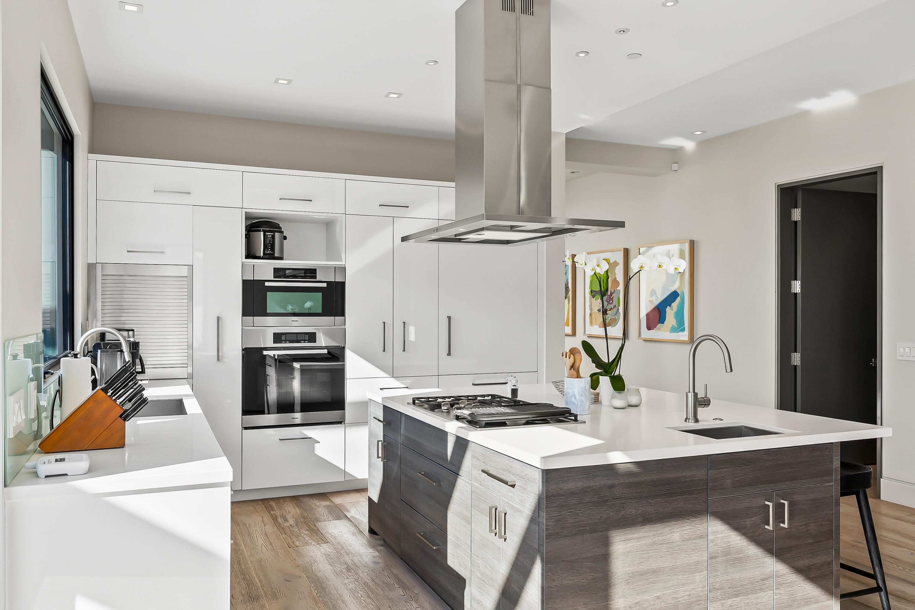 1131 Las Alturas Road, Unit SHARE B Santa Barbara, CA 93103 - Photo 6 of 32 a kitchen with stainless steel appliances kitchen island granite countertop a stove refrigerator and cabinets