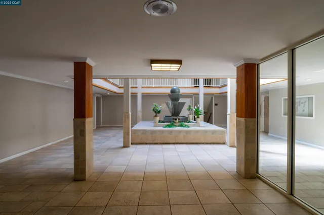 a front view of a building with a garden