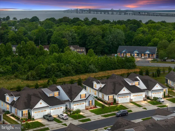 an aerial view of a house with garden space and street view