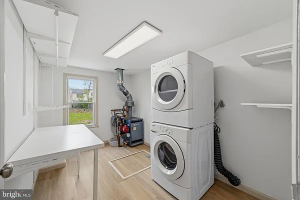 a view of a storage and utility room with washer and dryer