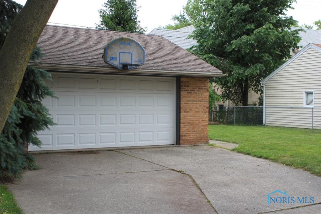 3128 Aldringham Road Toledo, OH 43606 - Photo 35 of 35 Two car garage with newer door and opener in 2009. Basketball hoop needs a net & a player!