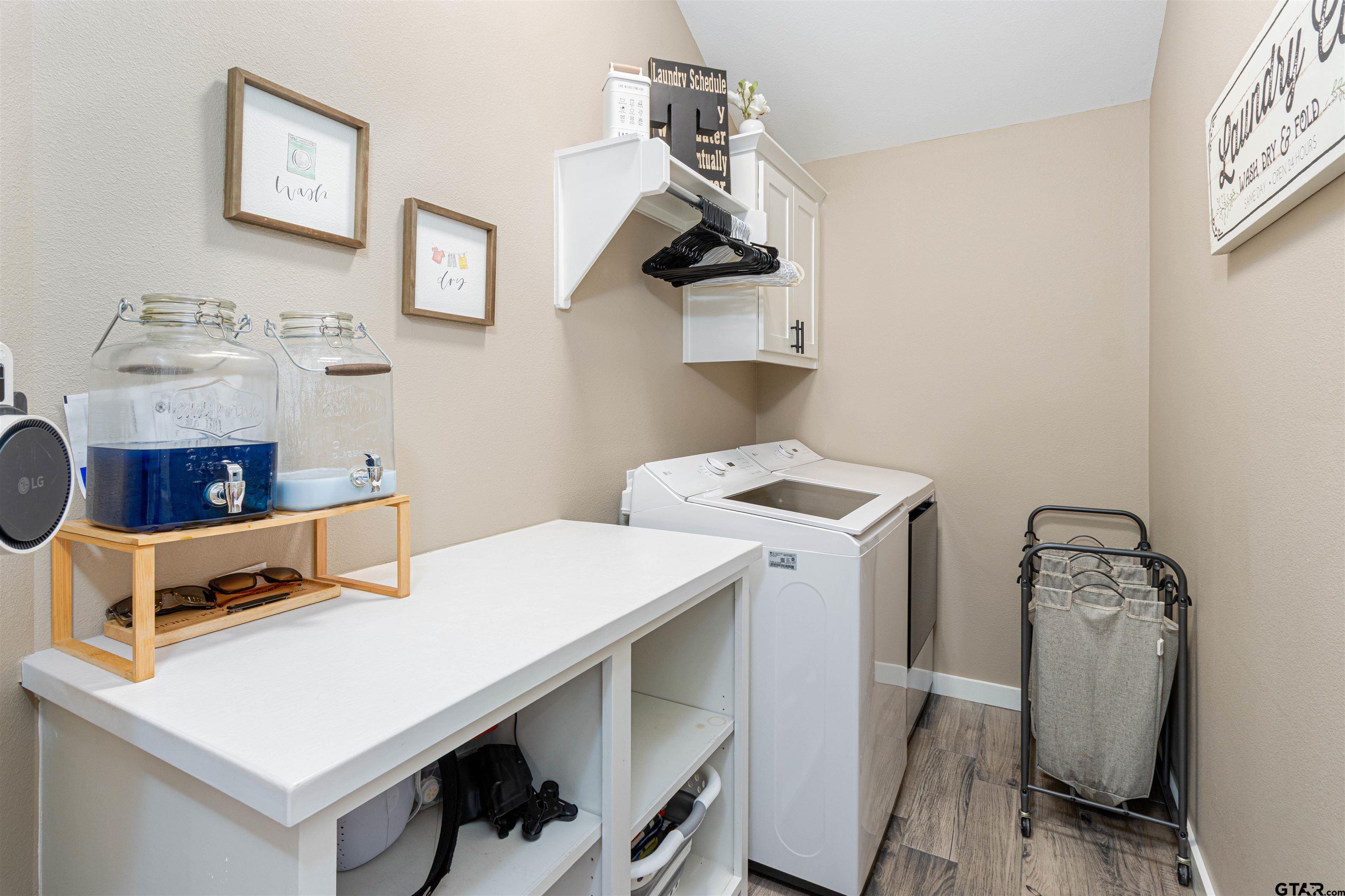 16210 Crossing Circle Lindale, TX 75771 - Photo 11 of 22 a utility room with dryer and washer