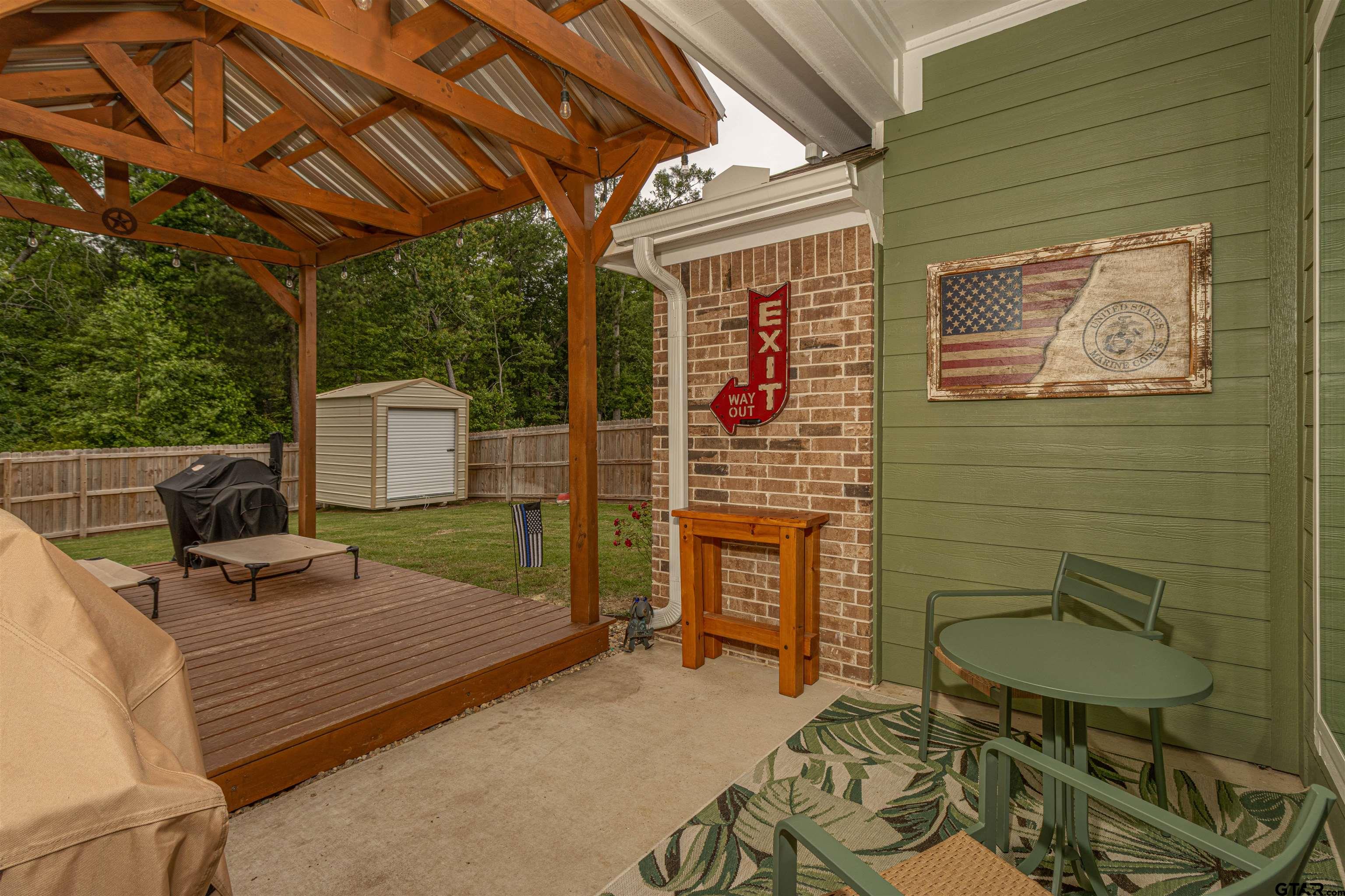 16210 Crossing Circle Lindale, TX 75771 - Photo 18 of 22 a backyard of a house with seating space