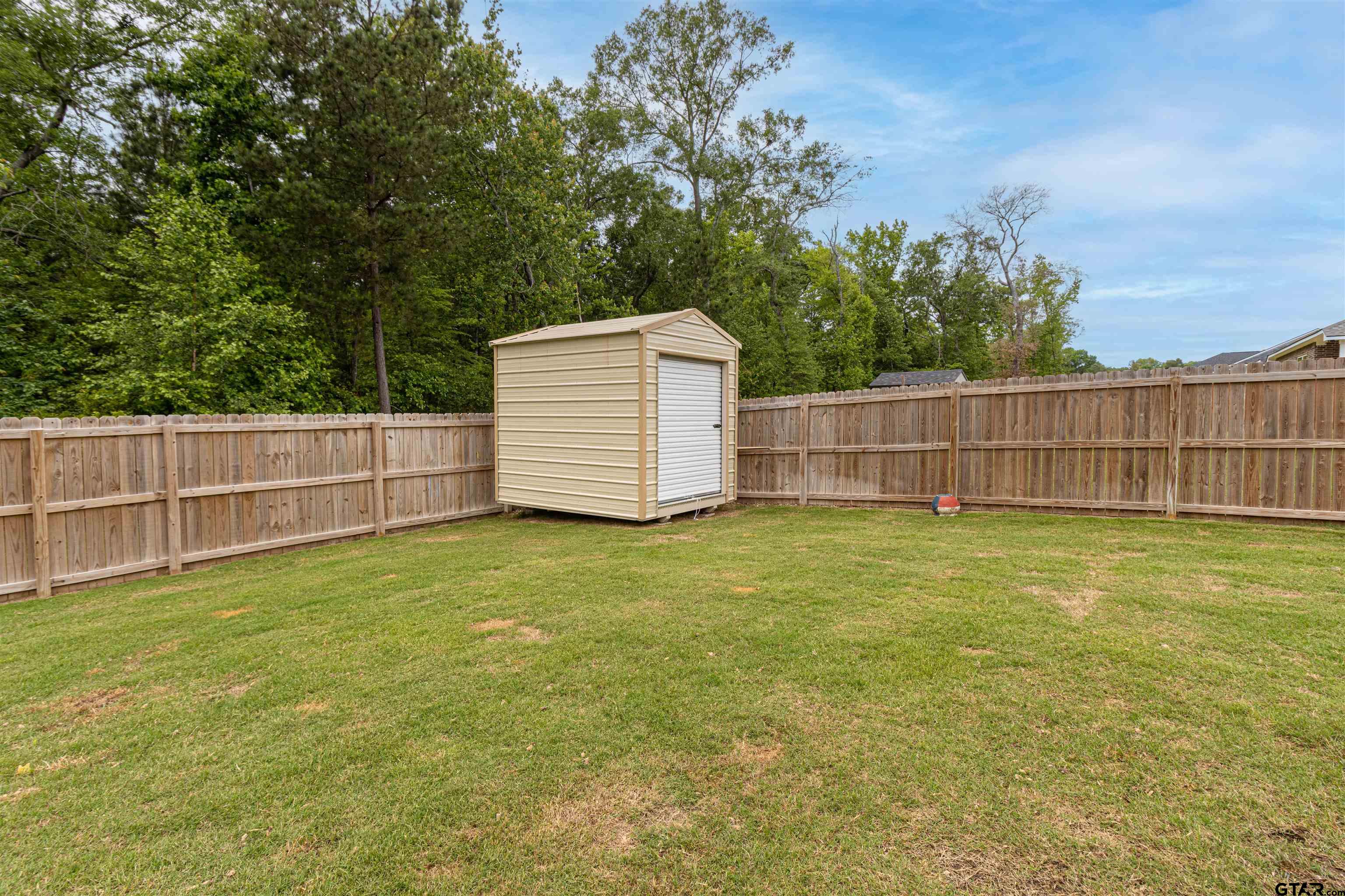 16210 Crossing Circle Lindale, TX 75771 - Photo 20 of 22 a view of a backyard