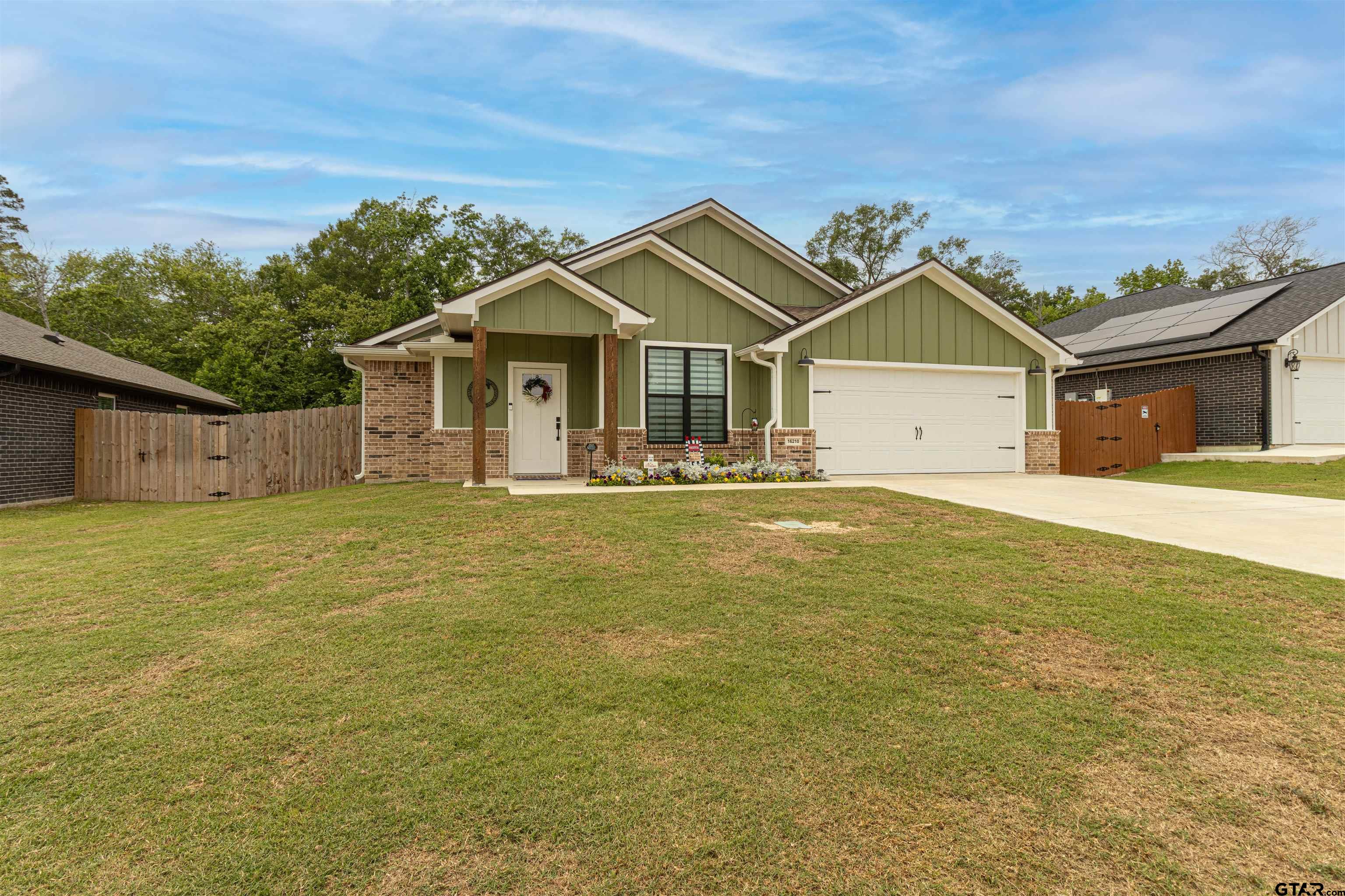 16210 Crossing Circle Lindale, TX 75771 - Photo 22 of 22 a front view of a house with a yard