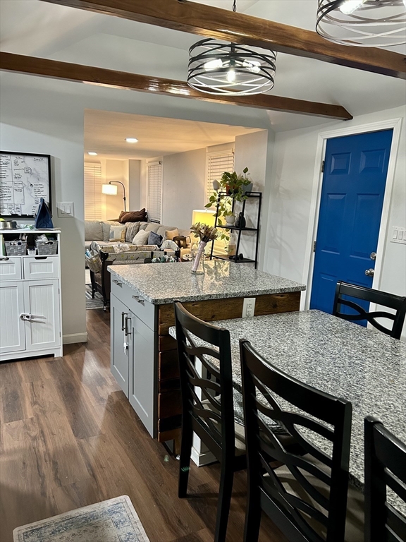 9 Church Street, Unit 9 Woburn, MA 01801 - Photo 11 of 31 a kitchen with a table and chairs in it