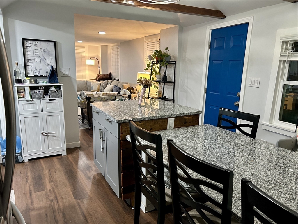 9 Church Street, Unit 9 Woburn, MA 01801 - Photo 13 of 31 a kitchen with a table and chairs in it