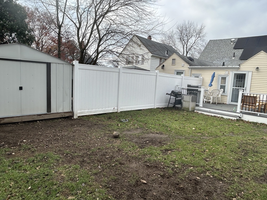 9 Church Street, Unit 9 Woburn, MA 01801 - Photo 28 of 31 a backyard of a house with table and chairs