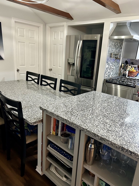 9 Church Street, Unit 9 Woburn, MA 01801 - Photo 10 of 31 a view of living room with cabinets and flat screen tv