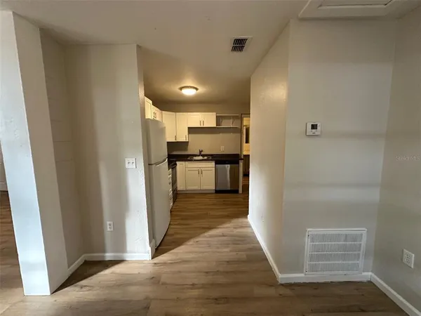 a view of a kitchen from the hallway