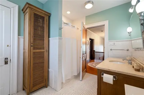 a bathroom with a sink and mirror