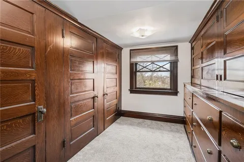 a hallway with windows and gate