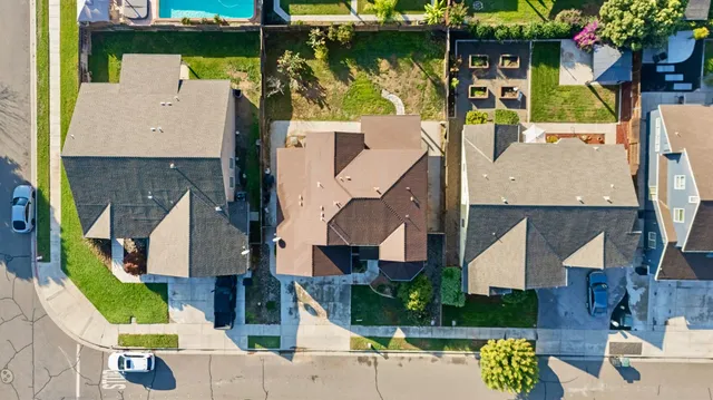 an aerial view of houses with outdoor space