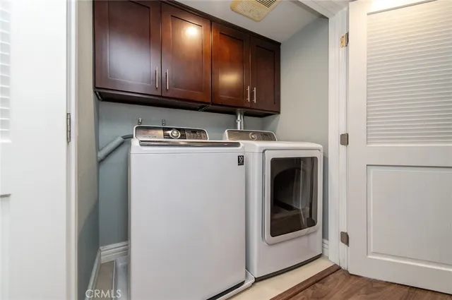 a view of a kitchen with washer and dryer
