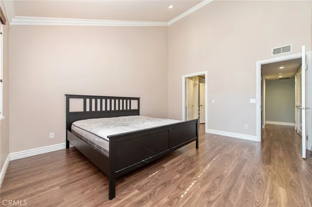 a bedroom with a bed and a table