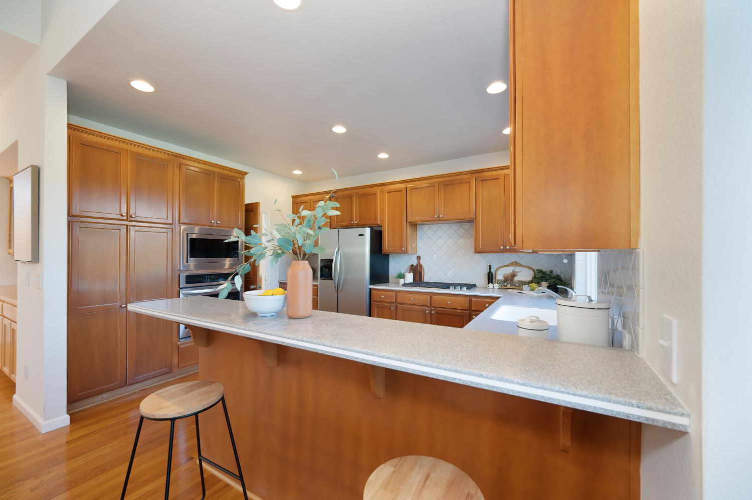 19740 Wedemeyer Place Applegate, CA 95703 - Photo 19 of 59 a kitchen with stainless steel appliances granite countertop a sink refrigerator and cabinets