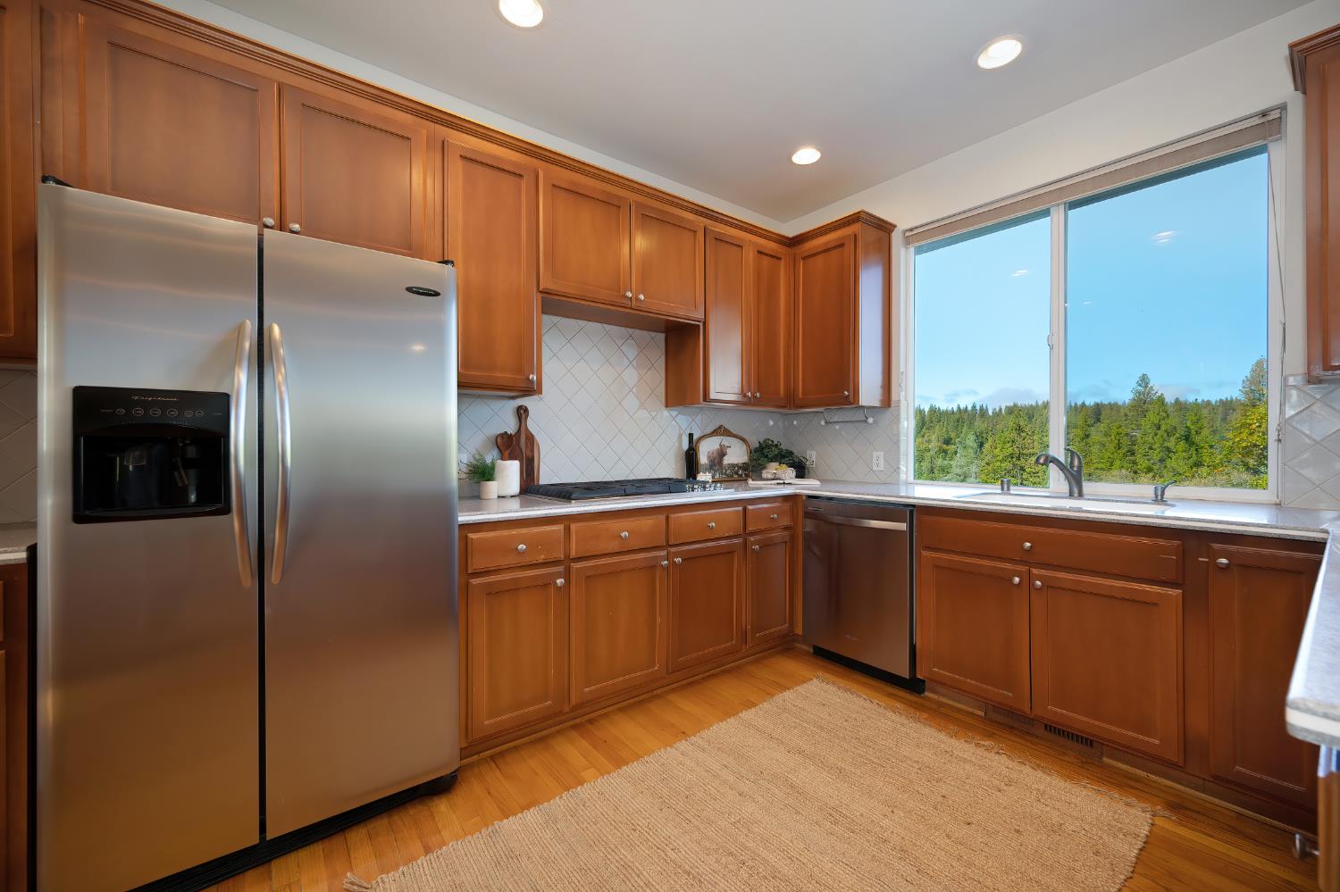 19740 Wedemeyer Place Applegate, CA 95703 - Photo 20 of 59 a kitchen with stainless steel appliances granite countertop a refrigerator and a sink