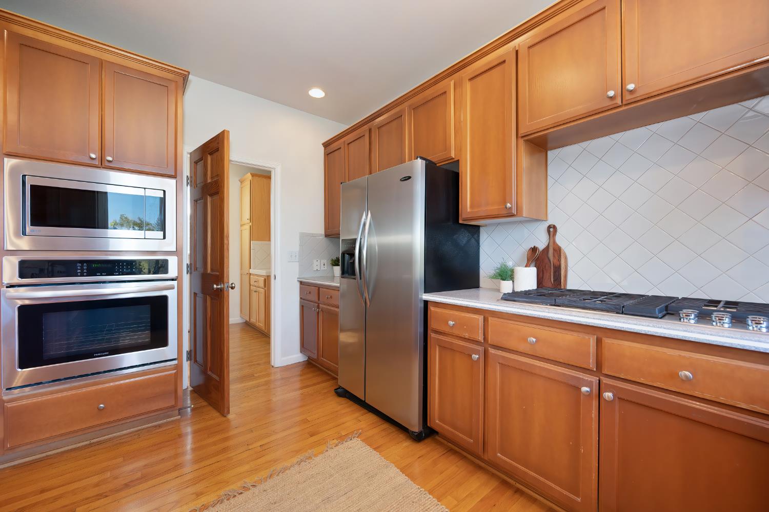 19740 Wedemeyer Place Applegate, CA 95703 - Photo 21 of 59 a kitchen with stainless steel appliances a stove microwave and refrigerator