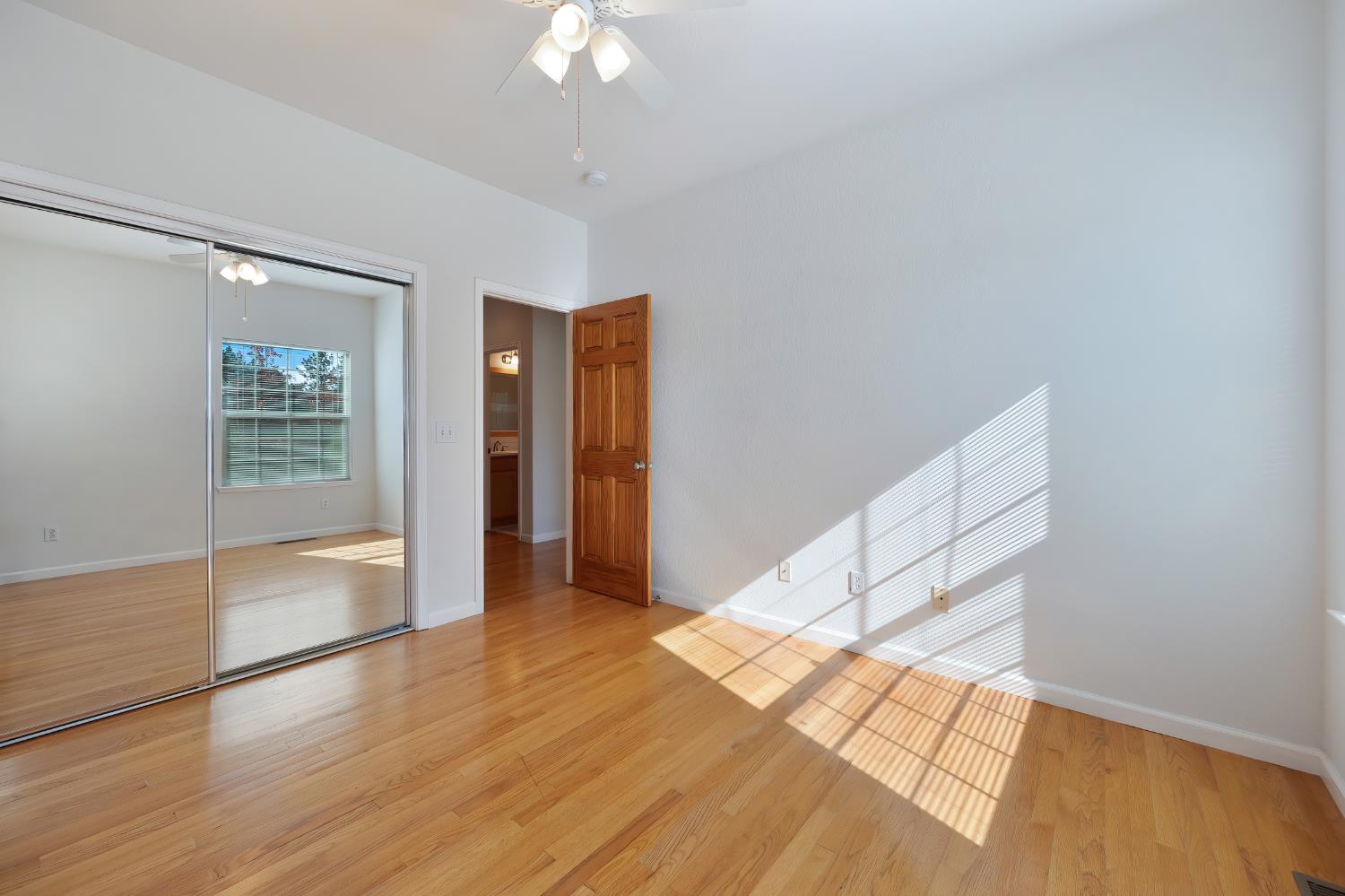 19740 Wedemeyer Place Applegate, CA 95703 - Photo 28 of 59 wooden floor in an empty room with a window