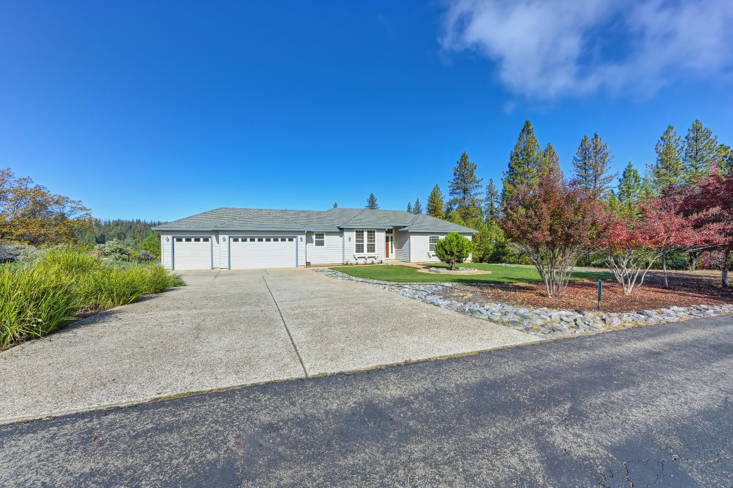 19740 Wedemeyer Place Applegate, CA 95703 - Photo 4 of 59 a view of a brick house with a yard