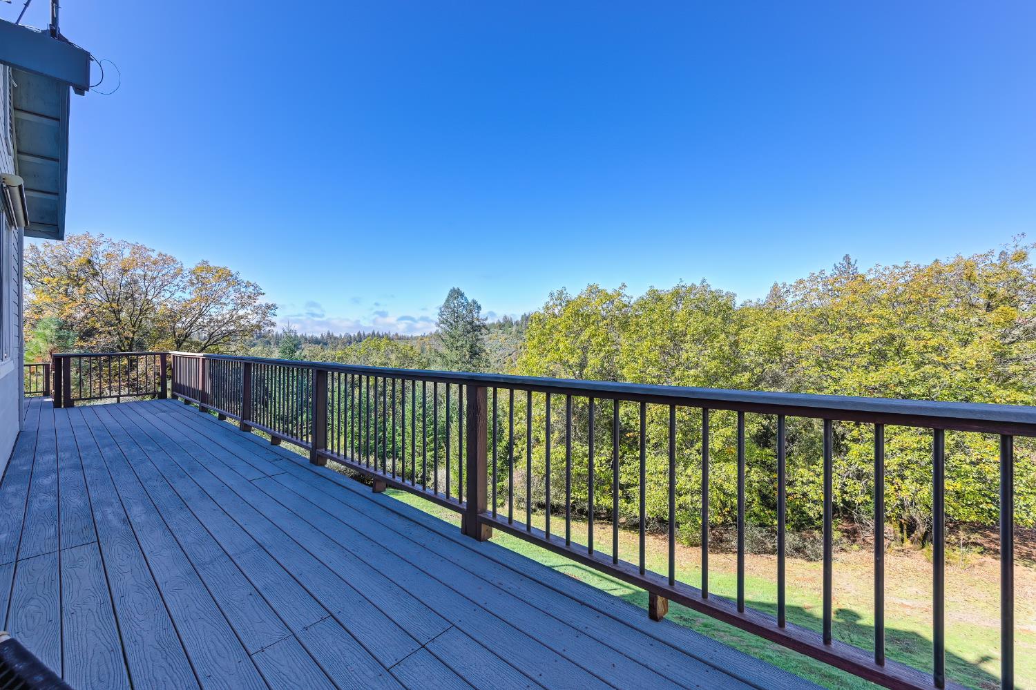 19740 Wedemeyer Place Applegate, CA 95703 - Photo 47 of 59 a balcony with wooden floor and fence