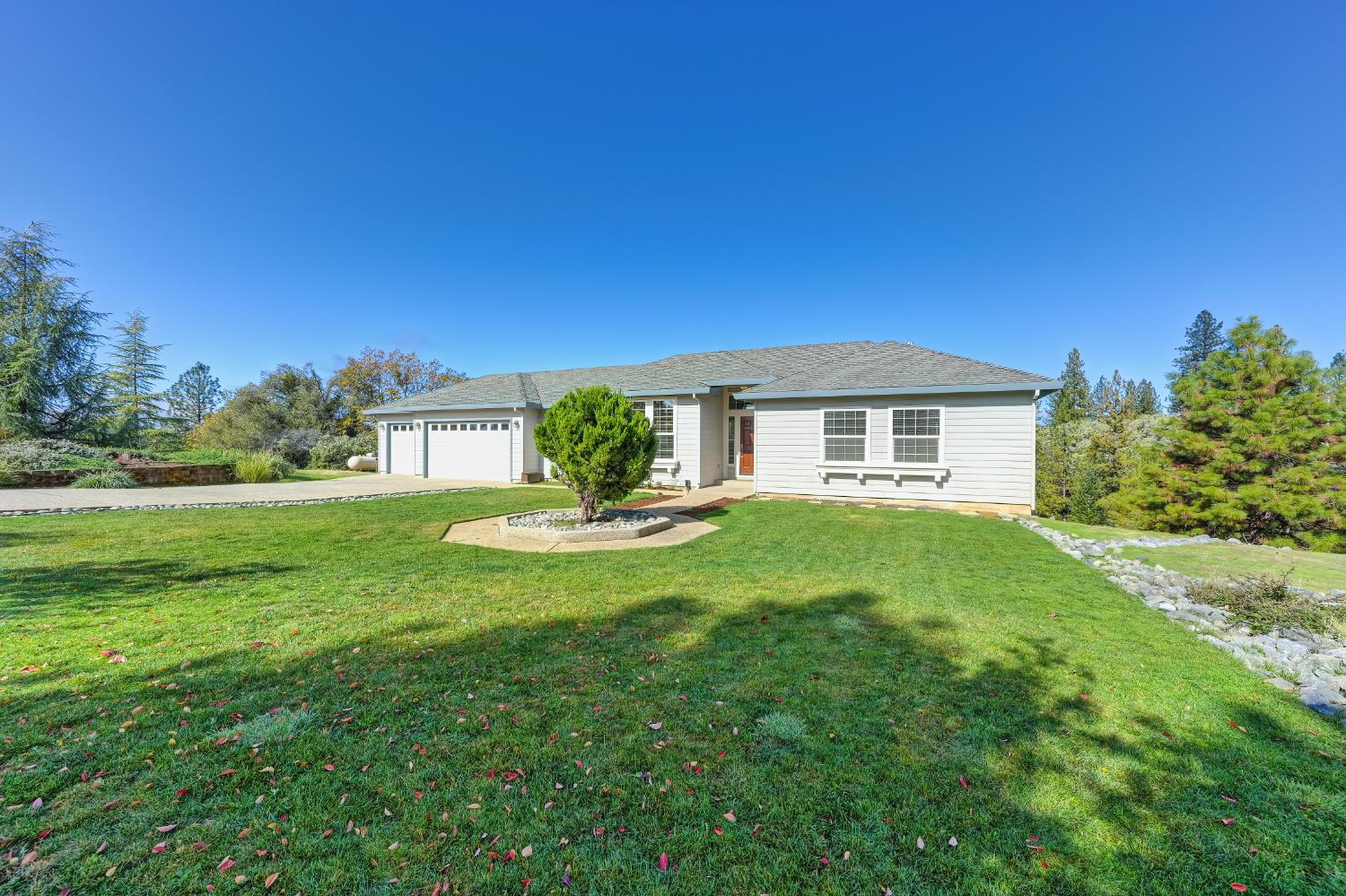 19740 Wedemeyer Place Applegate, CA 95703 - Photo 7 of 59 a front view of a house with a garden
