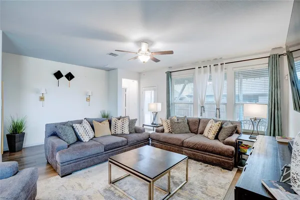 a living room with furniture and a large window