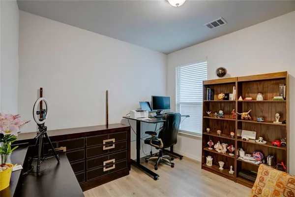a view of a workspace with furniture