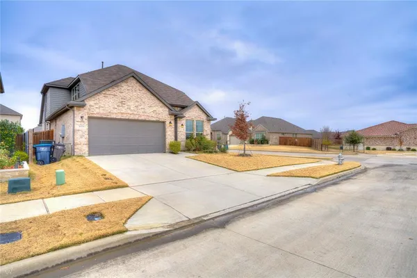 a view of swimming pool with a house in the background