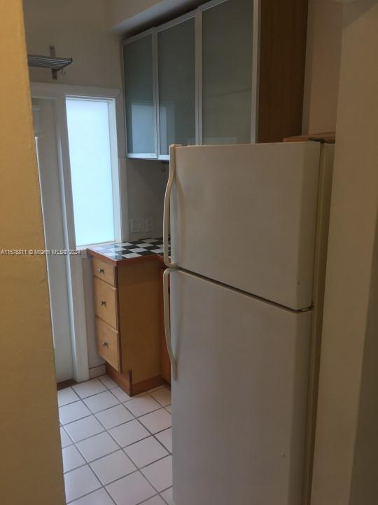 4720 Pine Tree Drive, Unit 17 Miami Beach, FL 33140 - Photo 2 of 9 a view of a refrigerator in kitchen
