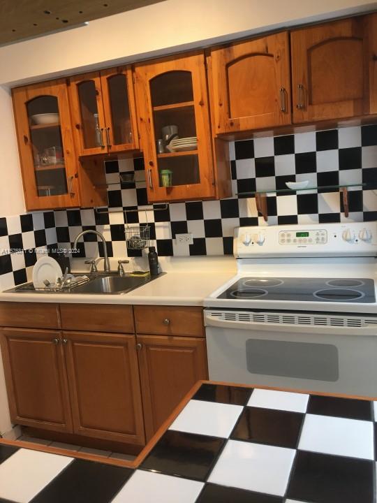4720 Pine Tree Drive, Unit 17 Miami Beach, FL 33140 - Photo 3 of 9 a sink with a black white checkered floor