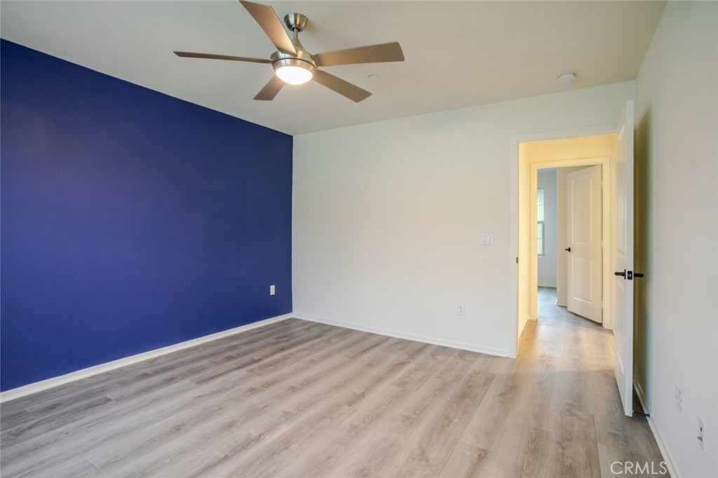 863 Iris Way, Unit B Azusa, CA 91702 - Photo 19 of 29 a view of empty room with wooden floor