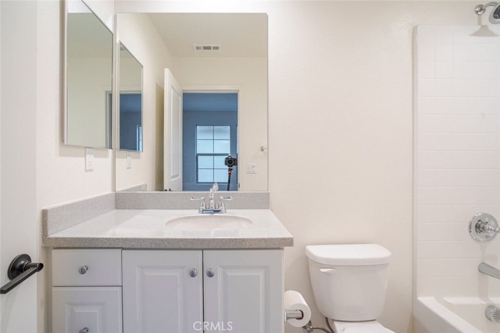 863 Iris Way, Unit B Azusa, CA 91702 - Photo 26 of 29 a bathroom with a sink toilet and shower
