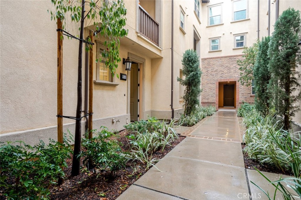 863 Iris Way, Unit B Azusa, CA 91702 - Photo 3 of 29 a front view of a house with garden