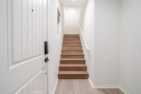 a view of entryway with wooden floor