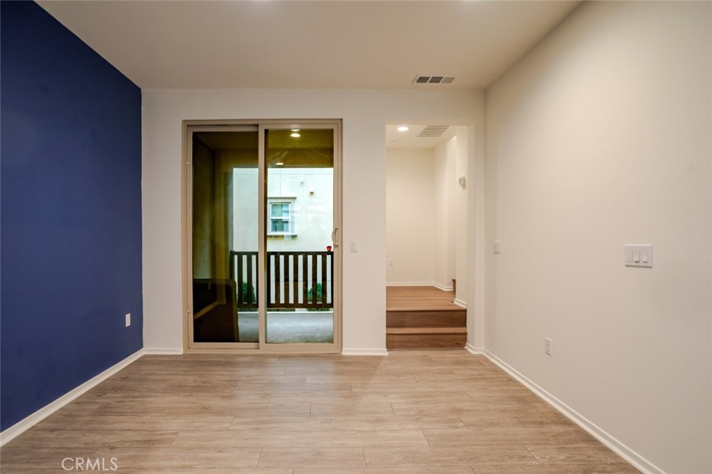 863 Iris Way, Unit B Azusa, CA 91702 - Photo 10 of 29 a view of entryway and hall with wooden floor