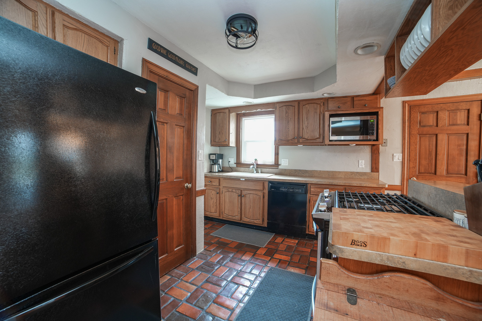 720 Periwinkle Turn Bourbonnais, IL 60914 - Photo 16 of 42 a kitchen with a refrigerator a microwave a sink and cabinets