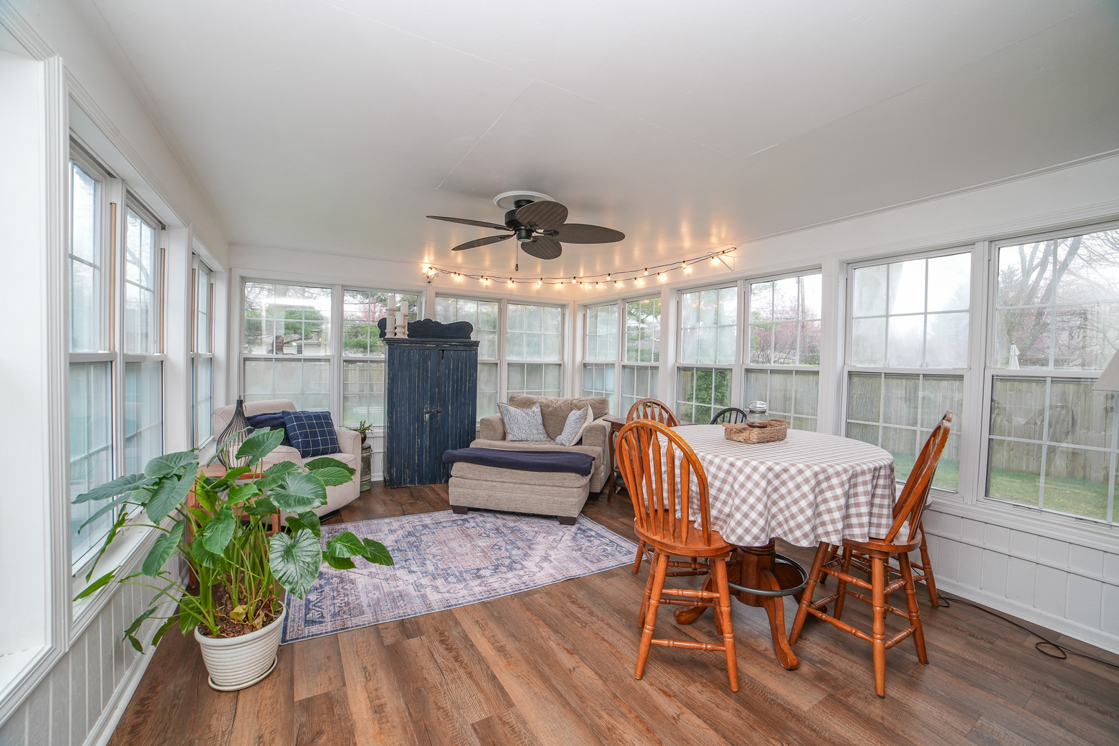 720 Periwinkle Turn Bourbonnais, IL 60914 - Photo 19 of 42 a dining room with furniture potted plants and wooden floor