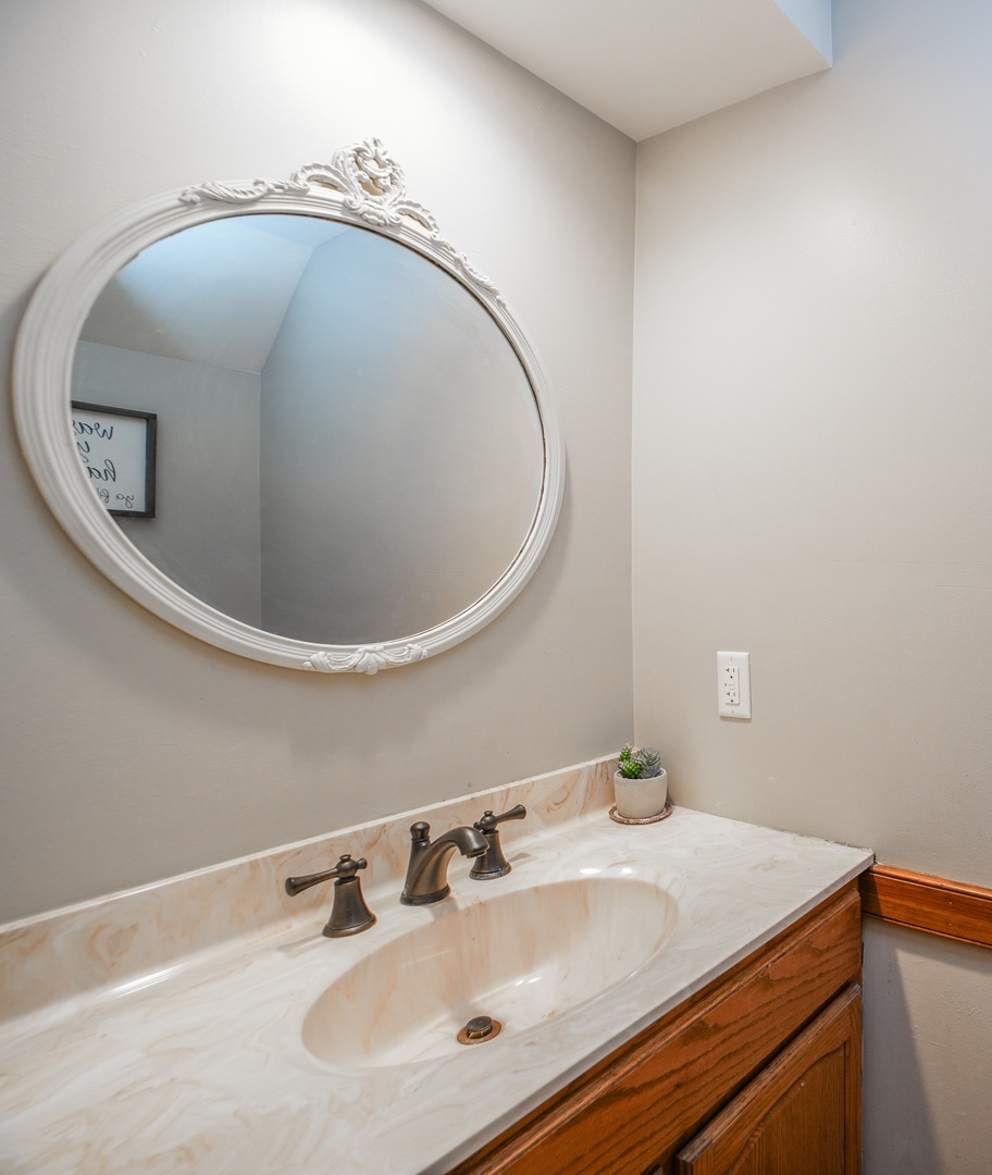720 Periwinkle Turn Bourbonnais, IL 60914 - Photo 21 of 42 a bathroom with a sink and a mirror