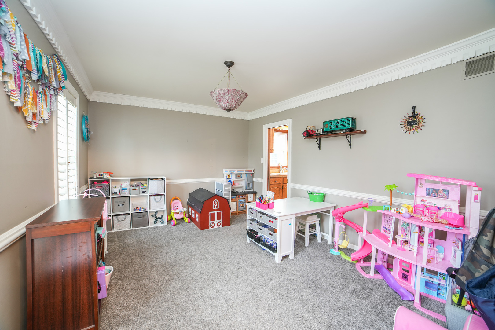 720 Periwinkle Turn Bourbonnais, IL 60914 - Photo 22 of 42 a bedroom with furniture and a chandelier