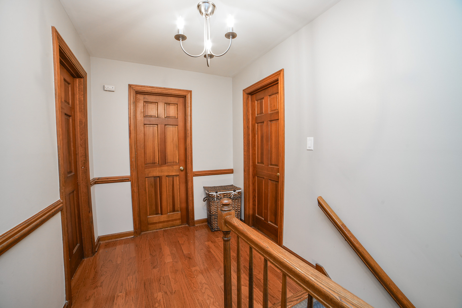 720 Periwinkle Turn Bourbonnais, IL 60914 - Photo 24 of 42 a view of a hallway to a livingroom with furniture staircase and a chandelier