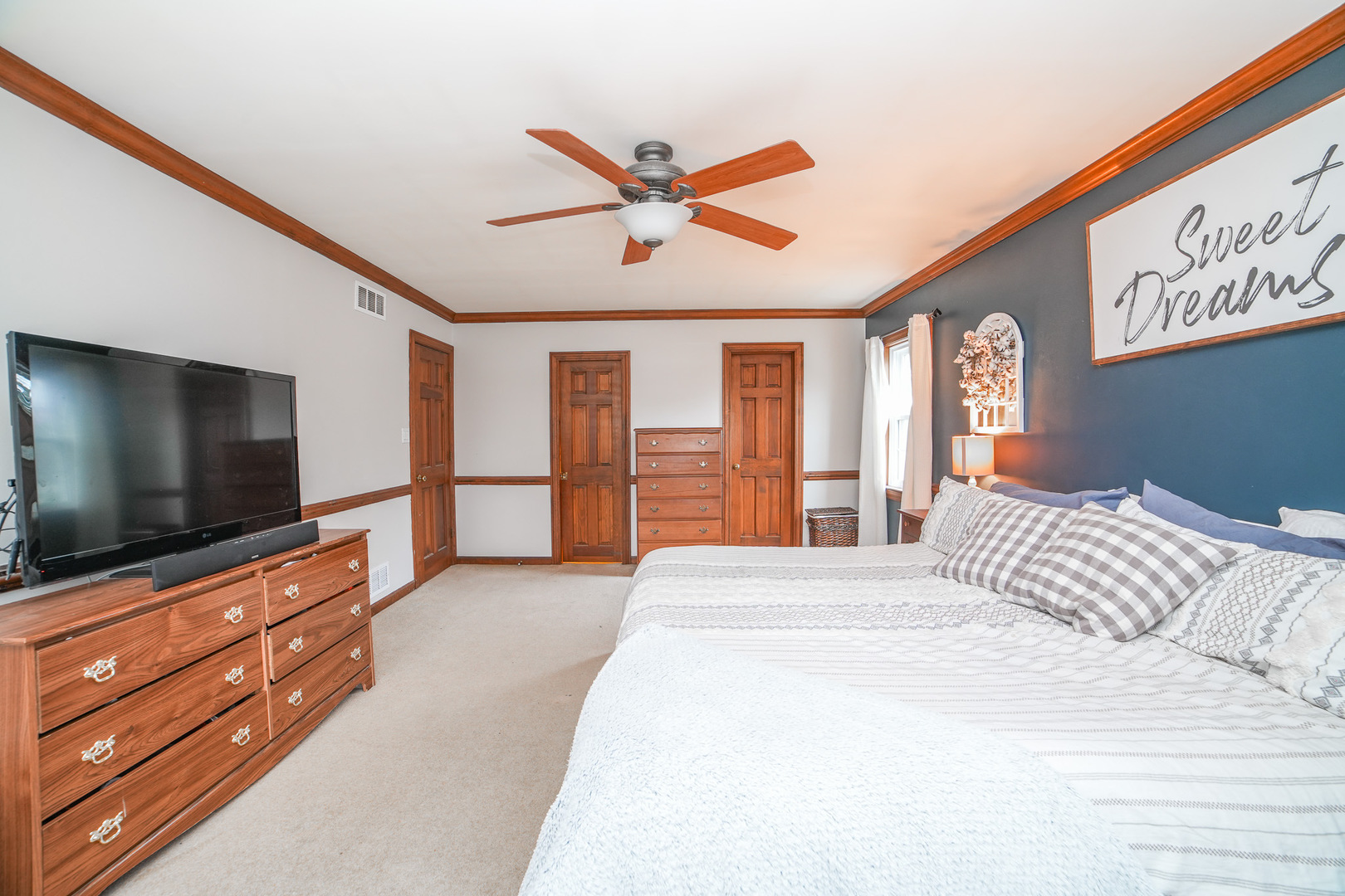 720 Periwinkle Turn Bourbonnais, IL 60914 - Photo 26 of 42 a bedroom with a bed and a flat screen tv