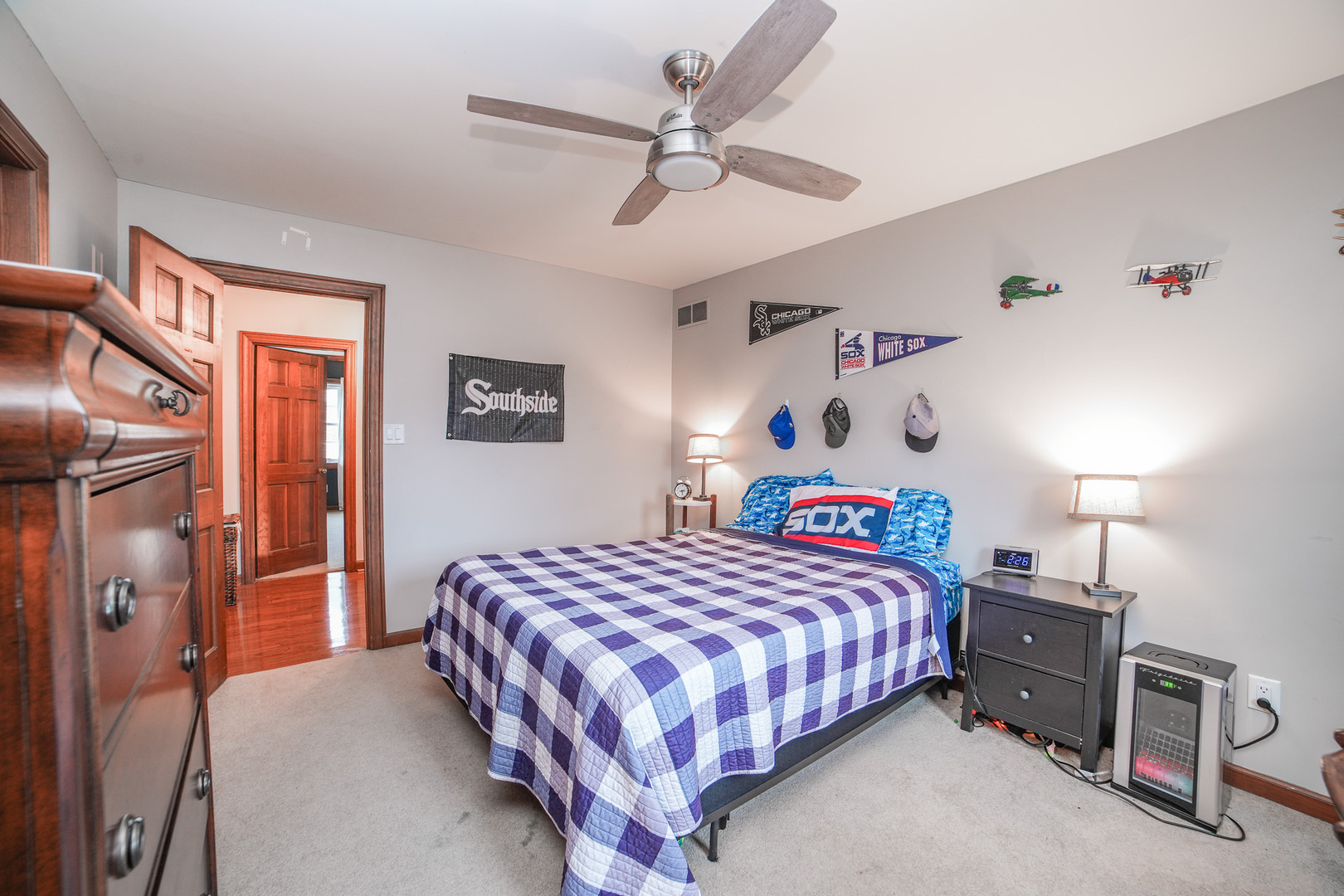 720 Periwinkle Turn Bourbonnais, IL 60914 - Photo 29 of 42 a bedroom with a bed and a chandelier