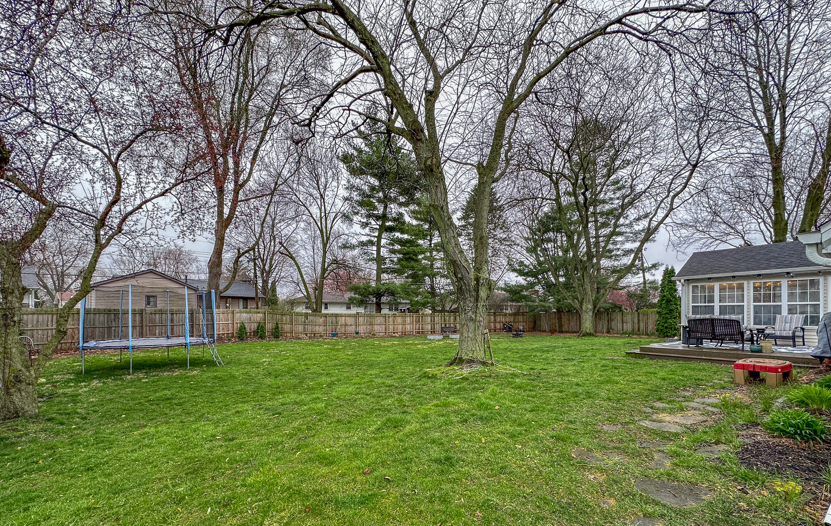 720 Periwinkle Turn Bourbonnais, IL 60914 - Photo 36 of 42 a view of a house with a big yard and large trees