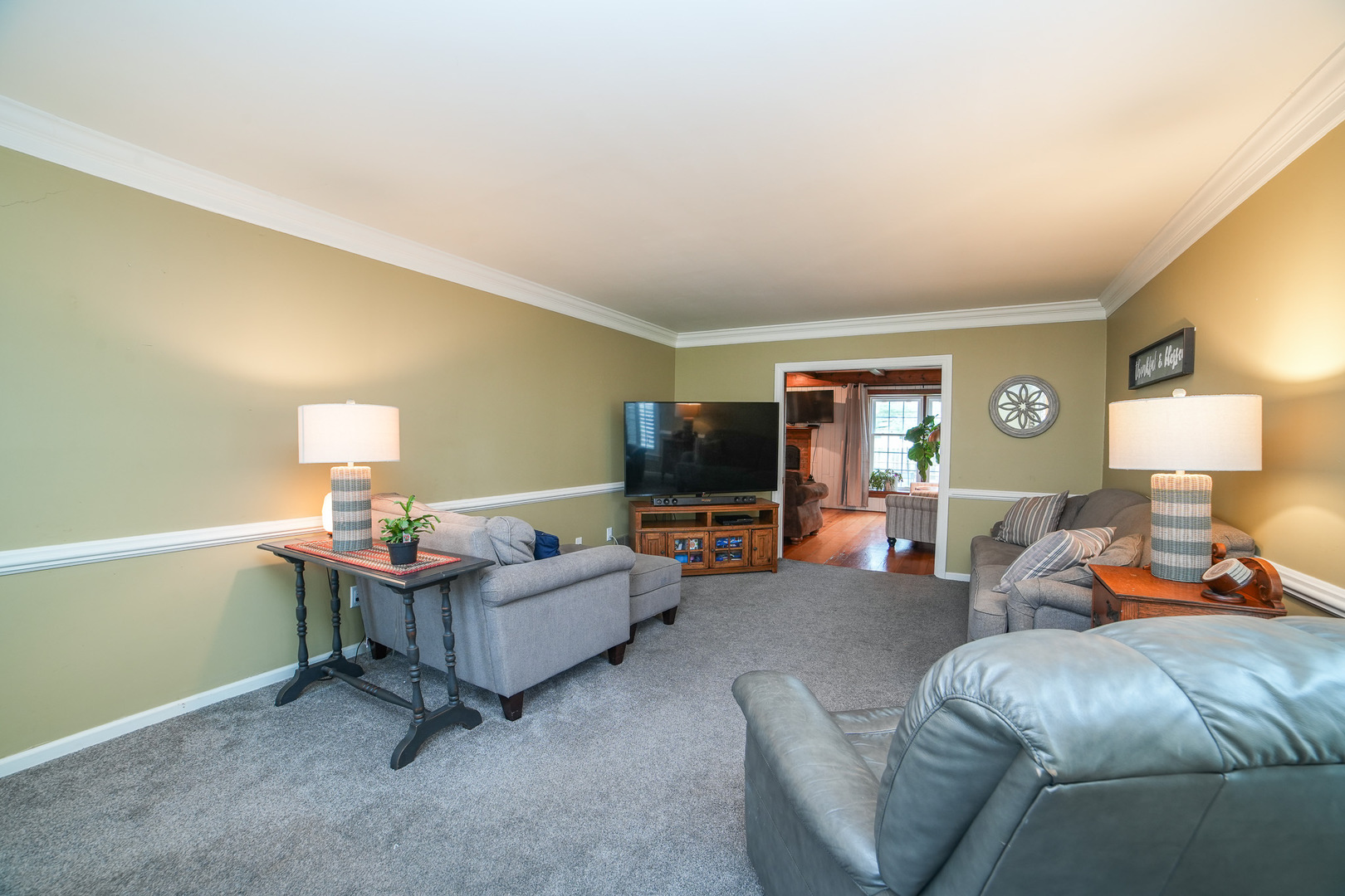 720 Periwinkle Turn Bourbonnais, IL 60914 - Photo 5 of 42 a living room with furniture and a flat screen tv