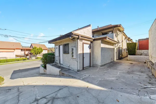a view of a house with backyard and a garage